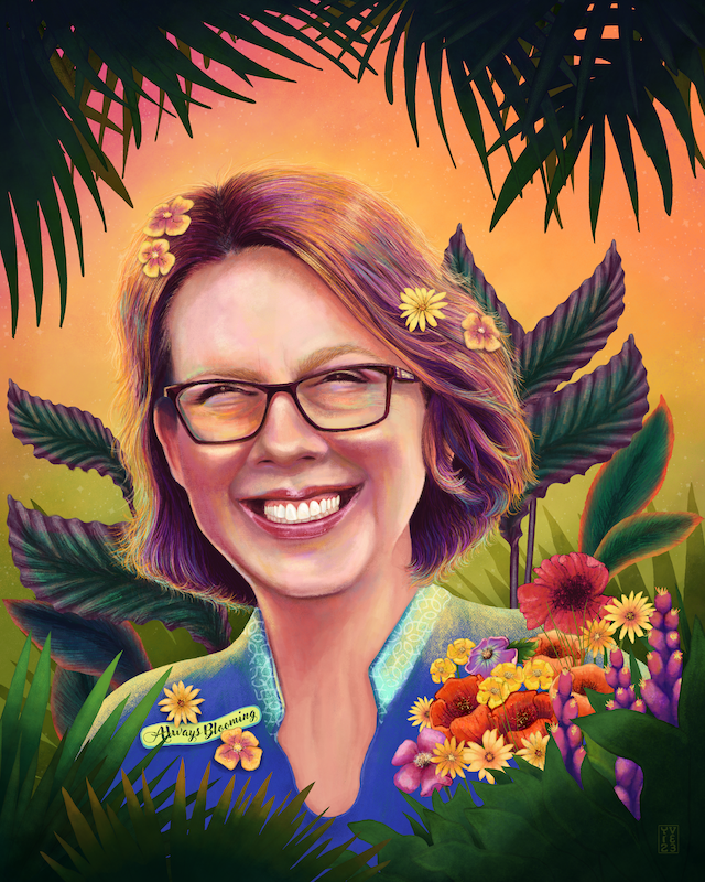 Digital illustration portrait of a white female with brown chin-length hair wearing rectangular frame glasses, a blue collarless open-neck shirt, smiling with teeth showing. There are flowers in her hair, on her blue shirt and in a bouquet in front of her. There is green foliage in the foreground, background and overhead. There is text in hand-lettering which reads "Always Blooming". The overall feel is warm and friendly.